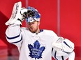 Maple Leafs goaltender Frederik Andersen puts back his helmet during the second period against Montreal Canadiens at Bell Centre on Saturday.