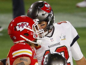 Buccaneers QB Tom Brady, right, clashes with Chiefs' Tyrann Mathieu after Bucs' Antonio Brown scored a touchdown during Super Bowl LV at Raymond James Stadium in Tampa, Fla, Sunday, Feb. 7, 2021.