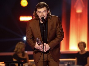 Morgan Wallen accepts and award onstage during the The 54th Annual CMA Awards at Nashville’s Music City Center, Nov. 11, 2020.