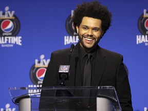 Recording artist The Weeknd speaks at the halftime show press conference ahead of Super Bowl LV Thursday, Feb. 4, 2021, in Tampa, Fla.