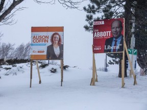 Election campaign signs are shown in St. John's, N.L., on Thursday, Feb. 11, 2021. A COVID-19 outbreak has led to in-person voting being halted for Saturday's provincial election, with mail-in ballots due by March 1.