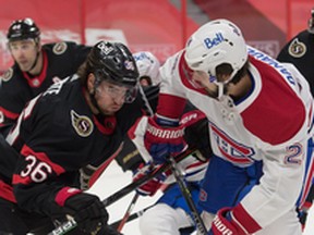 Ottawa Senators centre Colin White (left) faces off against Montreal Canadiens center Phillip Danault at the Canadian Tire Centre, Fe. 21, 2021.