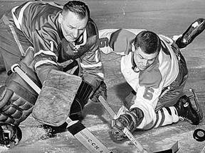 Montreal Canadiens' forward Ralph Backstrom moves in on Toronto Maple Leafs goaltender Johnny Bower during a 1964 game.