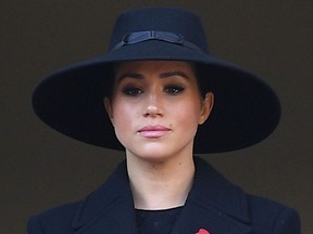 In this file photo taken on November 10, 2019 Britain's Meghan, Duchess of Sussex looks on from a balcony as she attends the Remembrance Sunday ceremony at the Cenotaph on Whitehall in central London, on November 10, 2019.