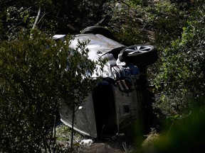 The vehicle driven by golfer Tiger Woods lies on its side in Rancho Palos Verdes, California, on February 23, 2021, after a rollover accident.