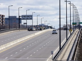 Sûreté du Québec stop vehicles on the Macdonald-Cartier Interprovincial Bridge as they entered Gatineau from Ottawa during April 2020.