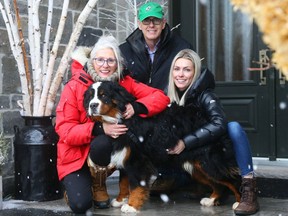 Ellie Methot, and her parents, Miriam and Hugh Campbell, are happy to be reunited with Rod, a Bernese mountain dog.