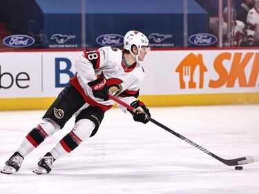 Senators left-winger Tim Stuetzle plays the puck in the second period of Thursday's game against the Canadiens.