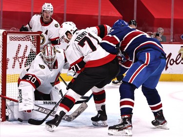 Senators goaltender Matt Murray (30) makes a save against Canadiens right-winger Josh Anderson (17) as centre Chris Tierney (71) defends during the third period.