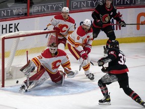 Ottawa Senators center Colin White scores against Calgary Flames goalie Artyom Zagidulin in the third period at the Canadian Tire Centre on Thursday.