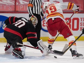 Ottawa Senators goalie Matt Murray makes a save in front of Calgary Flames left wing Matthew Tkachuk on Saturday at the Canadian Tire Centre.