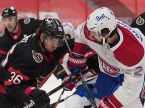Ottawa Senators center Colin White (36) faces off against Montreal Canadiens center Phillip Danault (24) in the first period at the Canadian Tire Centre.