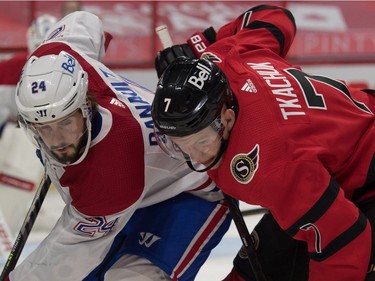 Canadiens centre Phillip Danault and Senators winger Brady Tkachuk battle for position after a faceoff in the second period.