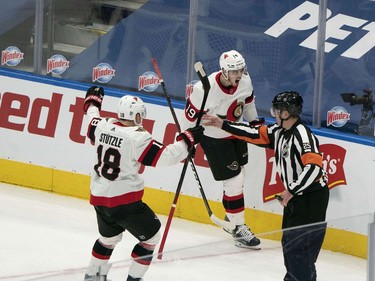 Ottawa Senators right wing Drake Batherson (middle) celebrates scoring a goal against the Toronto Maple Leafs with left wing Tim Stutzle during the first period at Scotiabank Arena in Toronto.
