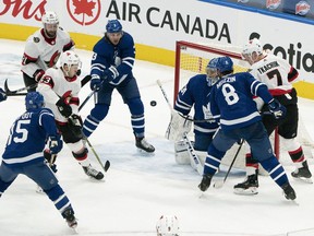 Senators winger Evgenii Dadonov (63) bats the puck out of the air and past Maple Leafs goaltender Frederik Anderson for the tying goal in the third period of Monday's game in Toronto.