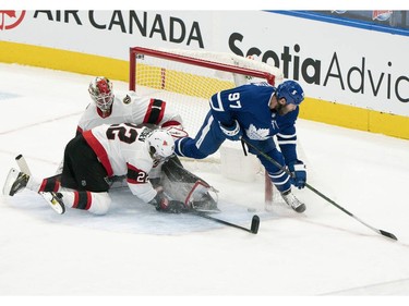 Toronto Maple Leafs center Joe Thornton scores a goal against the Ottawa Senators during the second period at Scotiabank Arena.