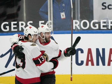 Ottawa Senators left wing Nick Paul (left) celebrates scoring a goal against the Toronto Maple Leafs with left wing Austin Watson during the second period at Scotiabank Arena in Tornto on Monday.