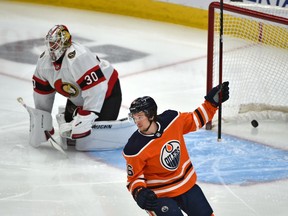 Edmonton's Kailer Yamamoto (56) celebrates a goal by Dominik Kahun (not seen) against Ottawa netminder Matt Murray on Sunday night. Murray was pulled after allowing three goals in the first period.