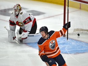 Edmonton Oilers Kailer Yamamoto (56) celebrates Dominik Kahun's (21) goal on Ottawa Senators goalie Matt Murray (30) during NHL action at Rogers Place in Edmonton, January 31, 2021.