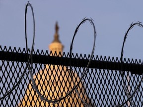 Newly-installed razor wire tops the unscalable fence surrounding the U.S. Capitol in the wake of the January 6th riot and ahead of the upcoming inauguration in Washington, U.S. January 14, 2021.