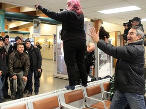 John Chabot, right, playfully backs up a photographer in a precarious pose during the Northern Lights Dream Tour's stop at Inuvik, N.W.T., in November 2012.