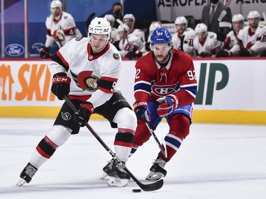 Josh Norris of the Senators skates with the puck against Jonathan Drouin of the Canadiens during the first period.