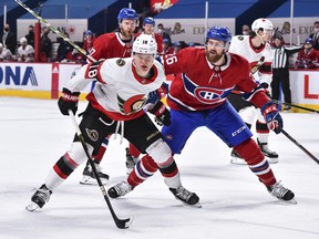 Senators winger Tim Stuetzle tries to hold off Jeff Petry of the Canadiens during first-period action on Tuesday, March 2, 2021.