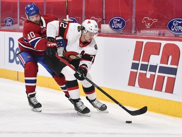 Joel Armia of the Canadiens challenges Thomas Chabot of the Senators during the second period.