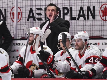 Senators head coach D. J. Smith yells out instructions from the bench in the seconde period against the Canadiens.