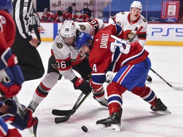 Colin White of the Senators and Phillip Danault of the Canadiens face off during the third period at the Bell Centre in Montreal on Tuesday night.