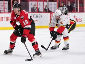 Belleville’s Alex Formenton goes in on net against the Stockton Heat last night.