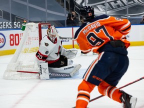 Ottawa Senators’ goaltender Matt Murray (30) makes a save on Edmonton Oilers’ Connor McDavid (97) during third period NHL action at Rogers Place in Edmonton, on Wednesday, March 10, 2021.