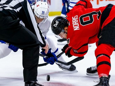 The Senators' Josh Norris wins a faceoff against the Maple Leafs' John Tavares during the first period.