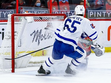 The puck bounces off Maple Leafs winger Ilya Mikheyev and into the net behind Senators goalie Anton Forsberg for a goal in the second period.