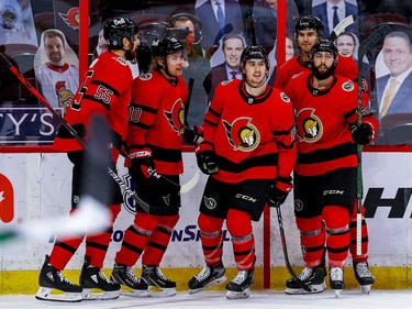 Senators left-winger Alex Formenton (middle) is congratulated by teammates on his goal against the Maple Leafs during the third period.