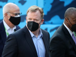 NFL commissioner Roger Goodell looks on while wearing a mask before Super Bowl LV.