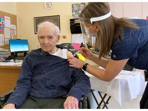 A public health RN immunizes a resident of a long-term care residence.