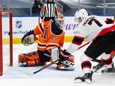 Ottawa Senators' Brady Tkachuk (7) scores on Edmonton Oilers' goaltender Mike Smith (41) during second period NHL action at Rogers Place in Edmonton, on Friday, March 12, 2021.