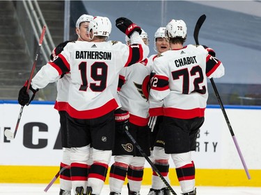 Ottawa Senators' Brady Tkachuk (7) celebrates scoring on Edmonton Oilers' goaltender Mike Smith (41) with teammates during second period NHL action at Rogers Place in Edmonton, on Friday, March 12, 2021.