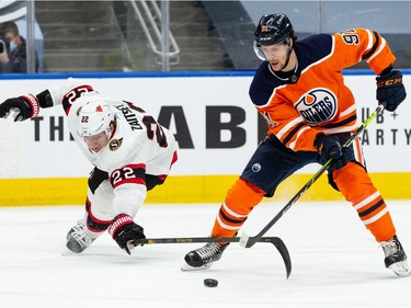 Edmonton Oilers' Gaetan Haas (91) beats Ottawa Senators' Nikita Zaitsev (22) to the puck during third period NHL action at Rogers Place in Edmonton, on Friday, March 12, 2021.