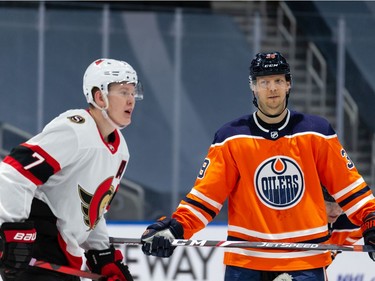 Edmonton Oilers' Alex Chiasson (39) isn't buying what  Ottawa Senators' Brady Tkachuk (7) is selling before a faceoff during third period NHL action at Rogers Place in Edmonton, on Friday, March 12, 2021.