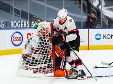Edmonton Oilers’ Gaetan Haas (91) scores then is shoved into Ottawa Senators’ goaltender Joey Daccord (34) by Brady Tkachuk (7) during third period NHL action at Rogers Place in Edmonton, on Friday, March 12, 2021.