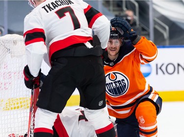 Edmonton Oilers' Gaetan Haas (91) scores then is shoved into Ottawa Senators' goaltender Joey Daccord (34) by Brady Tkachuk (7) during third period NHL action at Rogers Place in Edmonton, on Friday, March 12, 2021.