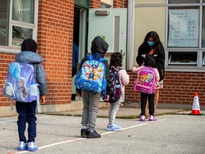 Students arrive at Hunter's Glen Junior Public School, part of the Toronto District School Board, in Scarborough, Sept. 15, 2020.