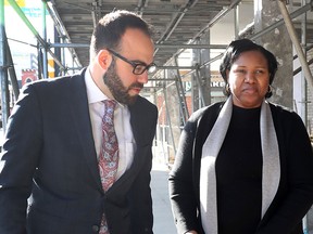 Aissatou Diallo walks to the Ottawa court house with her lawyer Solomon Friedman.