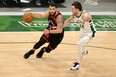 Raptors' Fred VanVleet drives to the basket as Bucks' Pat Connaughton defends during the first half at Fiserv Forum in Milwaukee on Tuesday, Feb. 16, 2021. STACY REVERE/GETTY IMAGES
