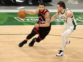Raptors' Fred VanVleet drives to the basket as Bucks' Pat Connaughton defends during the first half at Fiserv Forum in Milwaukee on Tuesday, Feb. 16, 2021. STACY REVERE/GETTY IMAGES