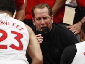 Toronto Raptors head coach Nick Nurse talks to his team in a huddle during the fourth quarter against the Detroit Pistons at Little Caesars Arena in Detroit, Mich., March 17, 2021.