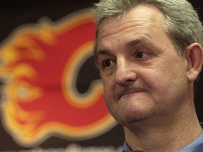 The Calgary Flames are turning to hard-nosed coach Darryl Sutter to turn their fortunes around. POSTMEDIA FILE