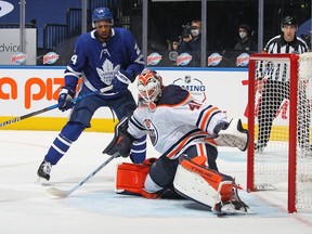 Maple Leafs forward Wayne Simmonds (left) looks for a rebound as Mike Smith of the Edmonton Oilers makes a toe save on Saturday night. The game was the fourth for Simmonds since returning from a broken wrist.